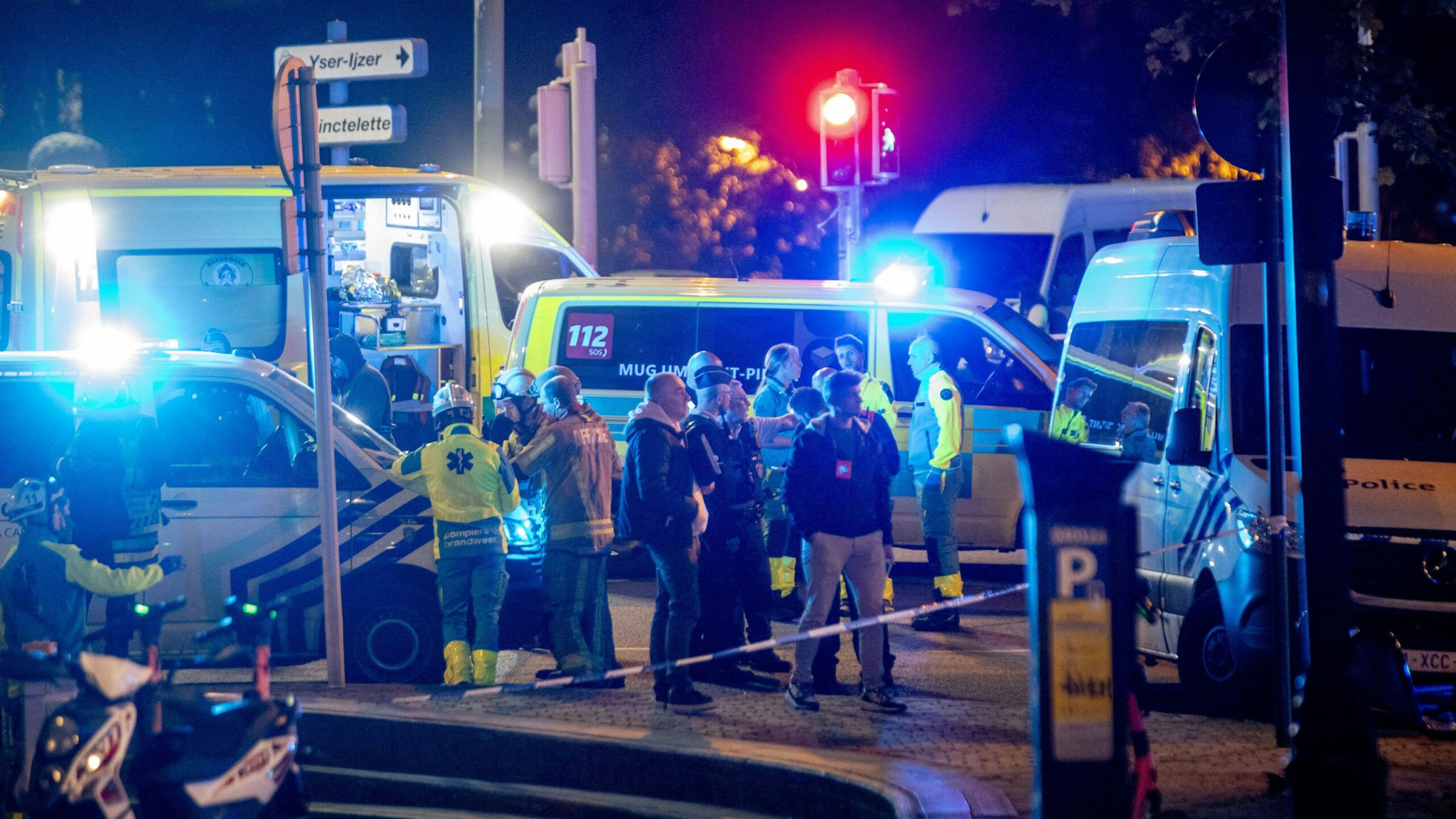 TOPSHOT - This photograph shows the police perimeter at the site of a shooting incident in the Ieperlaan - Boulevard d'Ypres, in Brussels, on October 16, 2023. Two people were killed during a shooting in Brussels on October 16, 2023 evening and the suspect was on the run, the Belgian capital's prosecutor's office said.