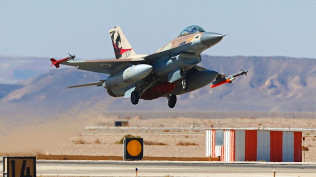 An Israeli air force F-16 fighter takes off during the "Blue Flag" multinational air defence exercise at the Ovda air force base, north of the Israeli city of Eilat, on October 24, 2021. - Israel is holding its largest-ever air force exercise this week, joined by several Western countries and India, with the United Arab Emirates air force chief visiting the drills.