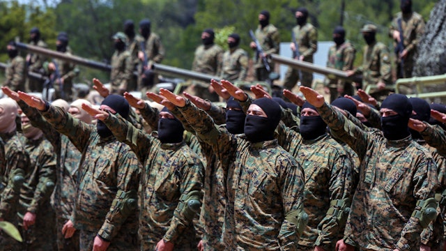 21 May 2023, Lebanon, Aramta: Pro-Iranian Hezbollah fighters take the oath during a staged military exercise in a camp in the Lebanese southern village of Aramta. The show came ahead of the 23rd "Liberation Day", the annual celebration of the withdrawal of Israeli forces from south Lebanon on May 25, 2000.