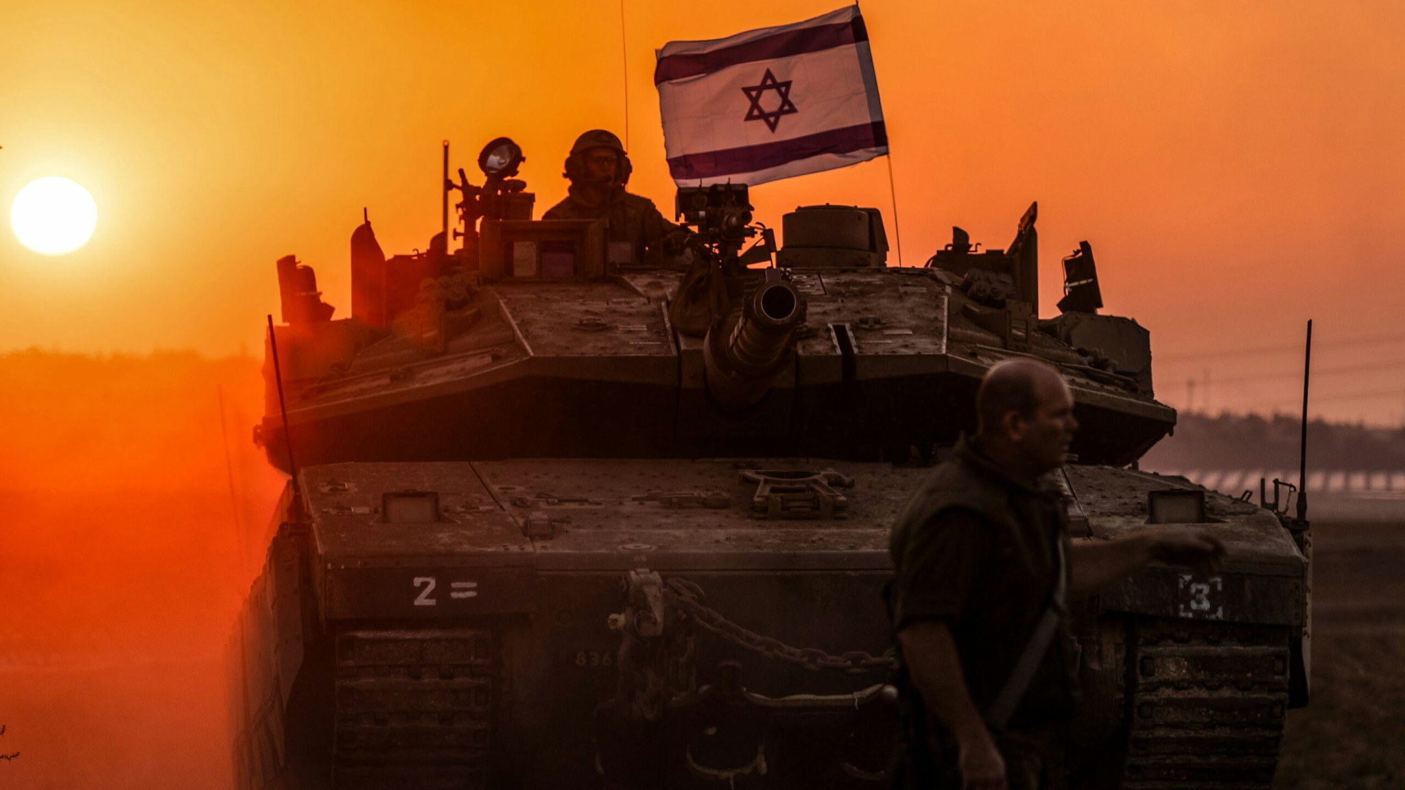 12 October 2023, Israel, Sderot: An Israeli soldier on a tank is seen near the Israel-Gaza border.