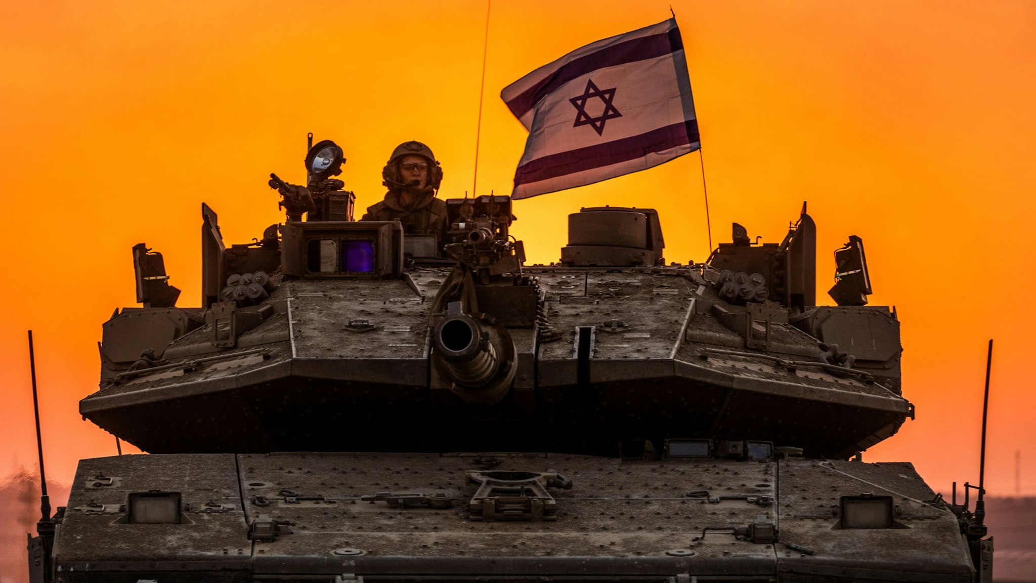 12 October 2023, Israel, Sderot: Israeli soldiers on a tank are seen near the Israel-Gaza border.