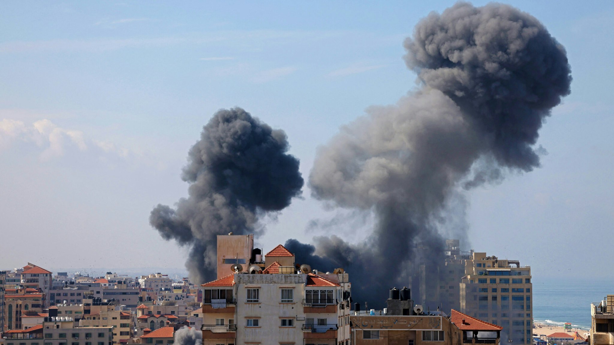 Smoke billows from a residential building following an Israeli airstrike in Gaza City on October 7, 2023. Barrages of rockets were fired at Israel from the Gaza Strip at dawn as militants from the blockaded Palestinian enclave infiltrated Israel, with at least one person killed, the army and medics said.
