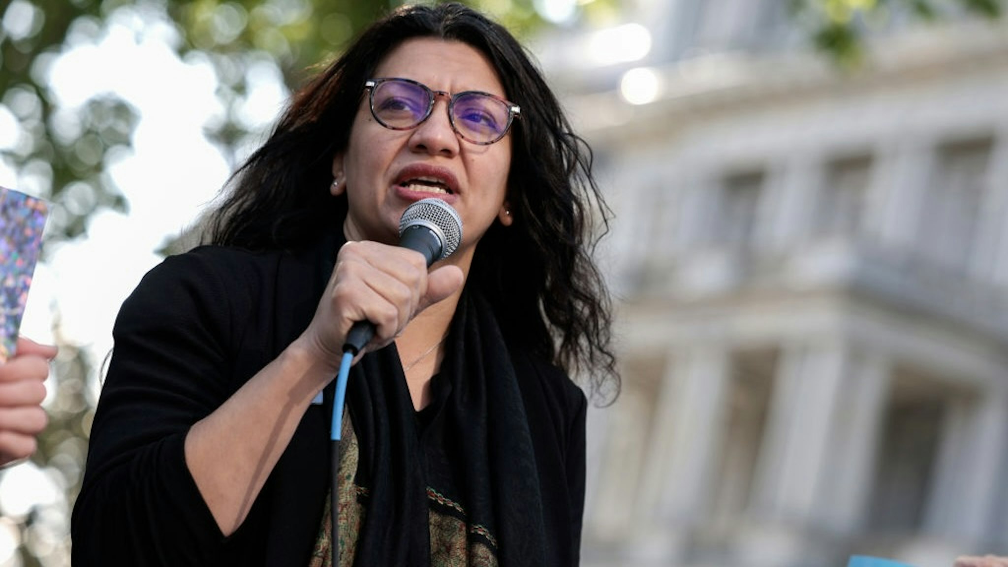 WASHINGTON, DC - APRIL 27: Rep. Rashida Tlaib (D-MI) speaks at a Student Loan Forgiveness rally on Pennsylvania Avenue and 17th street near the White House on April 27, 2022 in Washington, DC. Student loan activists including college students held the rally to celebrate U.S. President Joe Biden's extension of the pause on student loans and also urge him to sign an executive order that would fully cancel all student debt.