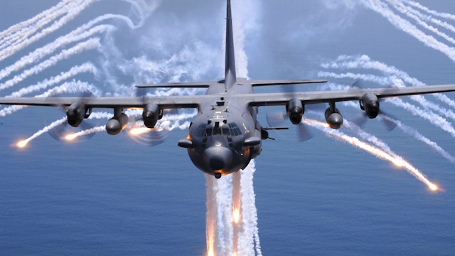 An AC-130H Gunship aircraft from the 16th Special Operations Squadron out of Hurlburt Field, Florida, jettisons flares as an infrared countermeasure during multi-gunship formation egress training August 24.