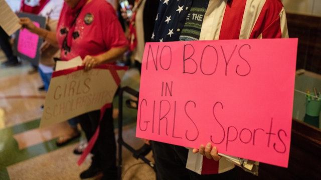 Demonstrators supporting restrictions on transgender student athletes are gathered at the Texas State Capitol on the first day of the 87th Legislature's third special session on September 20, 2021 in Austin, Texas.