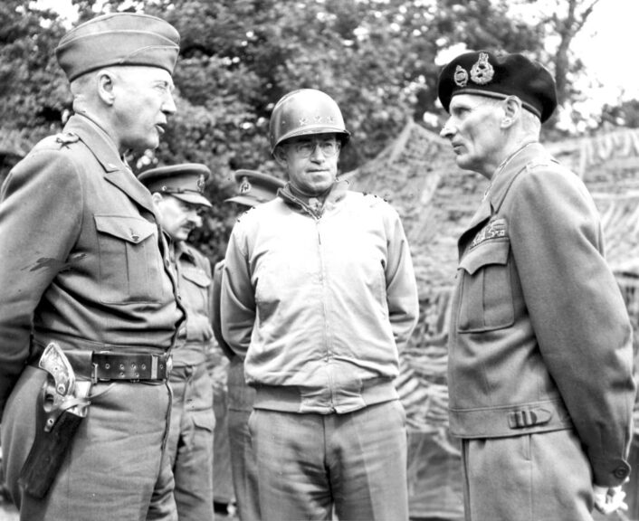 American Generals George S. Patton (1885 - 1945) (left) and Omar Bradley (1893 - 1981) (center) speak with British General Bernard Law Montgomery (1887 - 1976), July 7, 1944. (Photo by PhotoQuest/Getty Images)