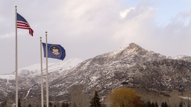 These are some of the mountains surrounding Midway and Heber City, Utah. This shot was taken in February when snow still covered most of the ground. Also visible are the American flag and Utah state flag.