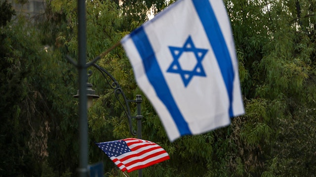 Flags of Israel and the US are hung up along streets by the Jerusalem municipality on July 10, 2022, ahead of US President Joe Biden's upcoming visit to Israel. (Photo by Ahmad GHARABLI / AFP) (Photo by AHMAD GHARABLI/AFP via Getty Images)