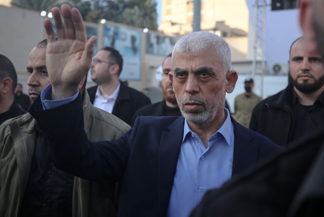 Yahia al-Sinwar, Gaza Strip chief of the Palestinian Islamist Hamas movement, waves to supporters during a protest held to mark Al-Quds (Jerusalem) Day, a commemorative day in support of the Palestinian people celebrated annually on the last Friday of the Muslim fasting month of Ramadan by an initiative started by late founder of the Islamic republic in Iran. in Gaza City on April 14, 2023. (Photo by Majdi Fathi/NurPhoto via Getty Images)