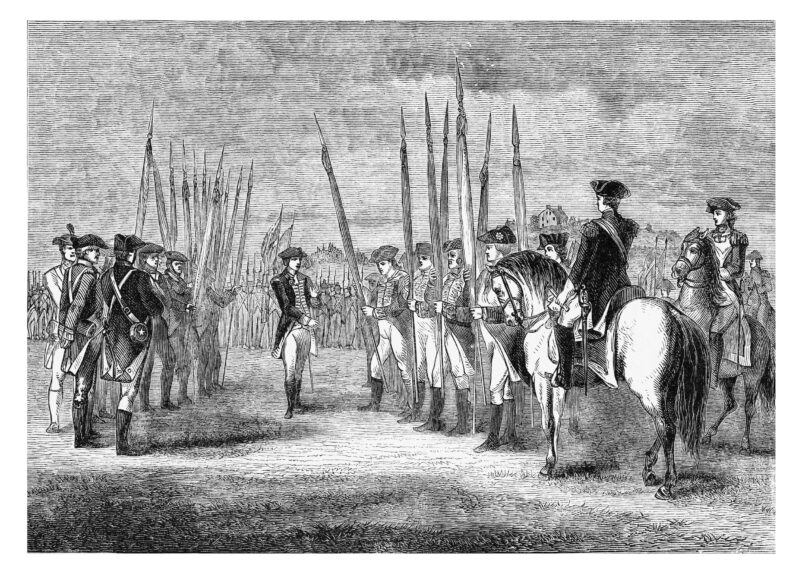 Old engraved illustration of Surrender of Charles Cornwallis to George Washington at Yorktown.mikroman6. Getty Images.