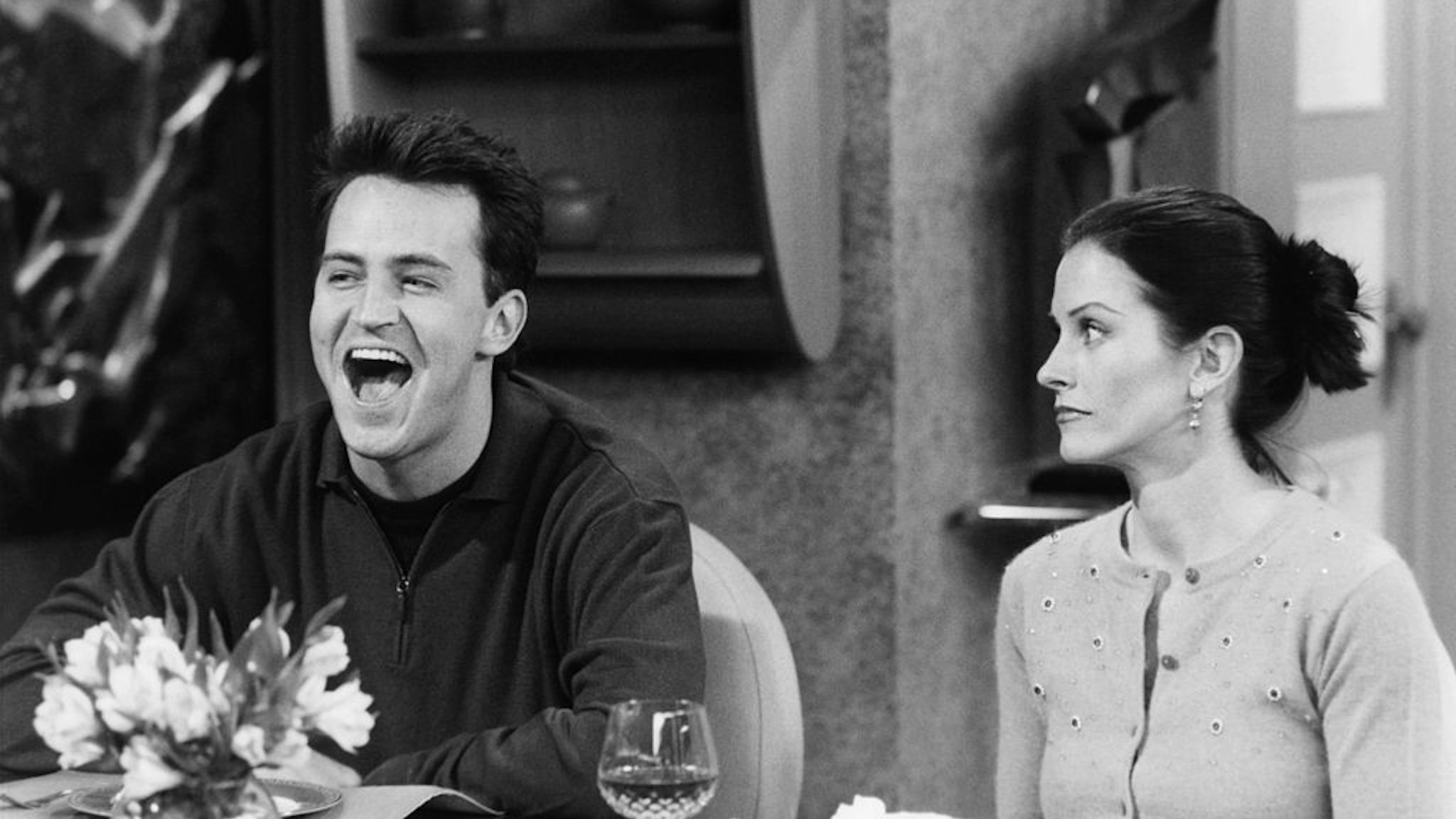 FRIENDS -- "The One with Chandler's Work Laugh" Episode 12 -- Air Date 01/21/1999 -- Pictured: (l-r) Matthew Perry as Chandler Bing, Courteney Cox as Monica Geller (Photo by NBCU Photo Bank/NBCUniversal via Getty Images via Getty Images)