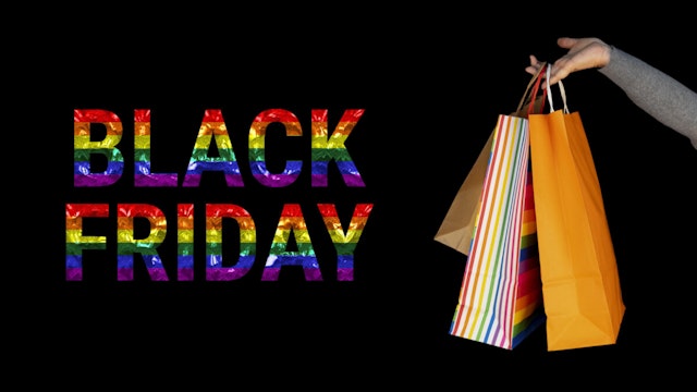 LGBT. Shopping bags in the woman hands. Joy of consumption. Purchases, black friday, discounts, sale concept. Black background.