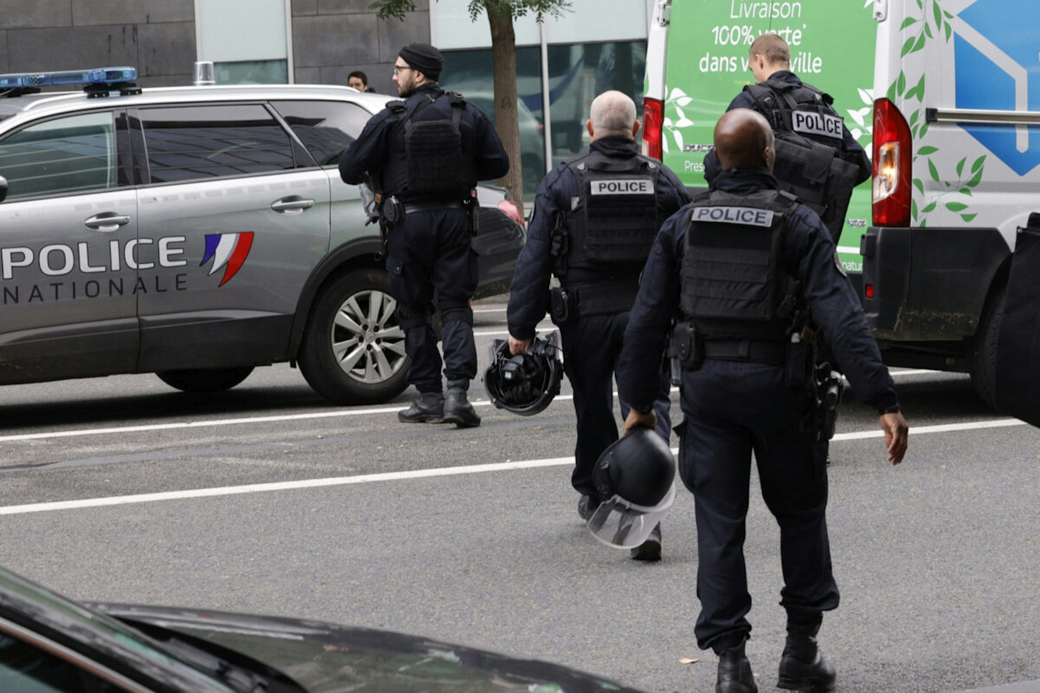 French police officers leave a metro station after a woman making threats on an RER train was shot and wounded by police, at the Bibliotheque Francois Mitterrand station, in Paris, on October 31, 2023.
