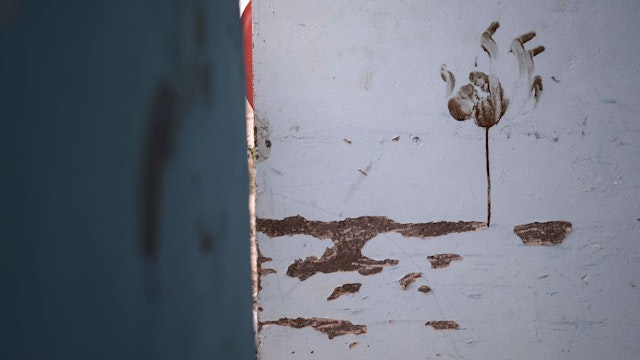 A picture taken on November 14, 2023 shows a blood handprint inside a bedroom at the Thai workers' residence at Kibbutz Nir Oz in southern Israel, after the October 7 attack by the Palestinian Hamas movement. (Photo by Kenzo TRIBOUILLARD / AFP) (Photo by KENZO TRIBOUILLARD/AFP via Getty Images)