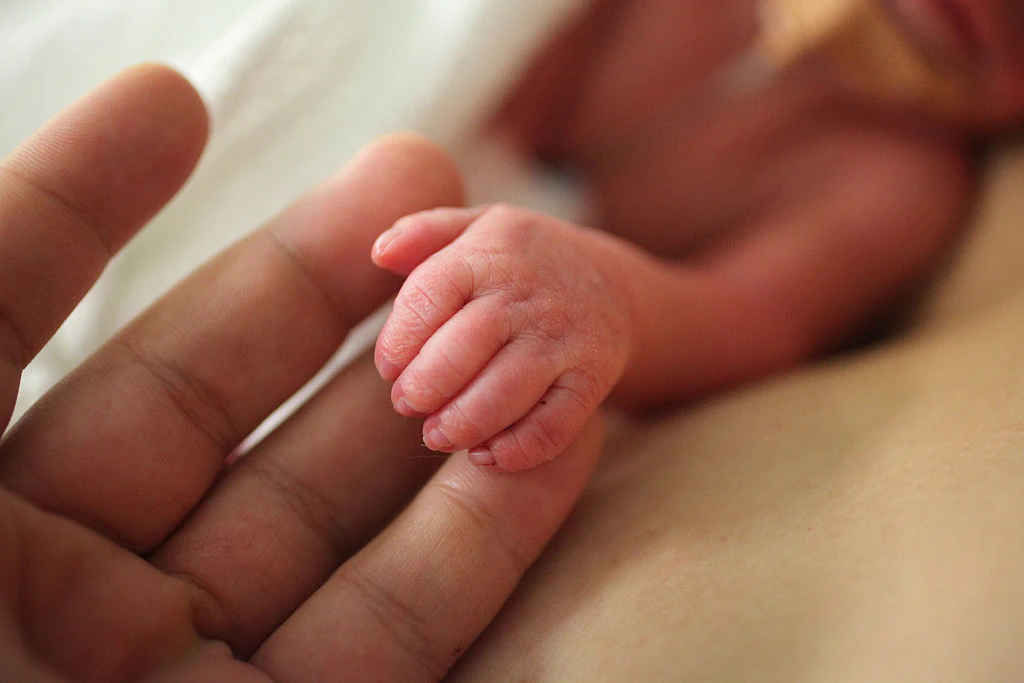 SYDNEY, NEW SOUTH WALES - MAY 17: Premature newborn hand in the Neonatal Intesive Care Unit at Royal Prince Alfred Hospital on May 17, 2015 in Sydney, Australia. The Neonatal care unit at Westmead Children's Hospital specialized in specialy care for newborns. (Photo by Jennifer Polixenni Brankin/Getty Images)