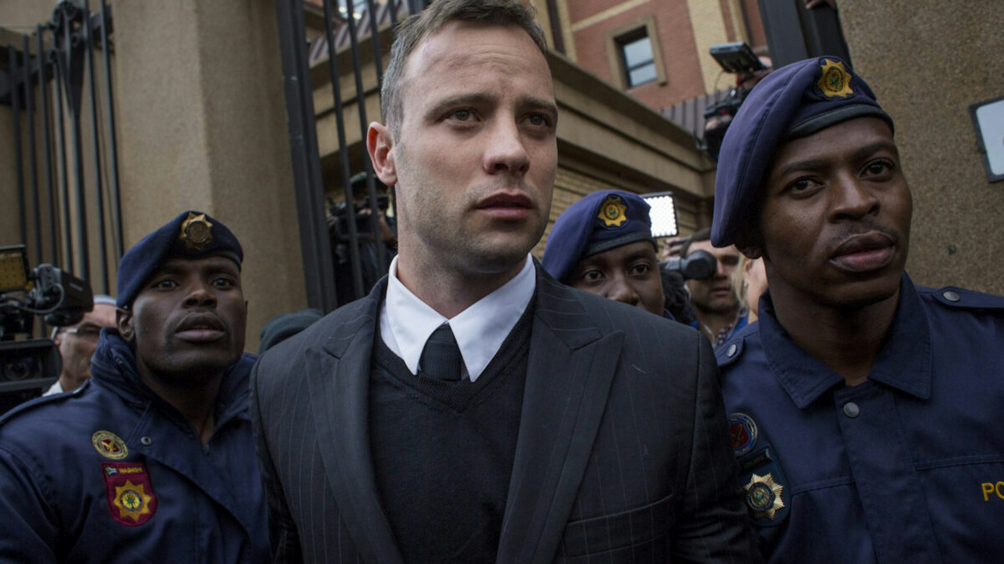 PRETORIA, SOUTH AFRICA - JUNE 14 : Oscar Pistorius leaves the North Gauteng High Court on June 14, 2016 in Pretoria, South Africa. Having had his conviction upgraded to murder in December 2015, Paralympian athlete Oscar Pistorius is attending his sentencing hearing and will be returned to jail for the murder of his girlfriend, Reeva Steenkamp, on February 14th 2013. The hearing is expected to last five days.