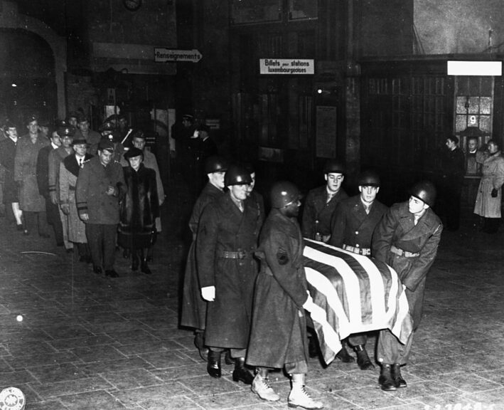 Pall bearers carry the casket of General George Patton through a Luxemburg train station. Patton was killed in a post-war traffic accident. (Photo by © CORBIS/Corbis via Getty Images)