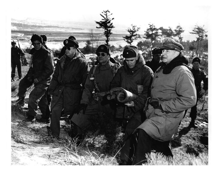 (Original Caption) : (Douglas MacArthur at the front lines above Suwon, Korea, accompained by Courtney J. Whitney, Matthew B. Ridgway, William B. Kean, and others.) Photoprint by USASC 28 Jan. 1951(no. SC 356736) lot 8755 (Photo by Library of Congress/Corbis/VCG via Getty Images)