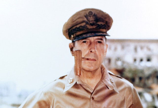 General of the Army Douglas MacArthur smoking his corncob pipe, probably at Manila, Philippine Islands, 2 August 1945. Photograph from the Army Signal Corps Collection in the U.S. National Archives.