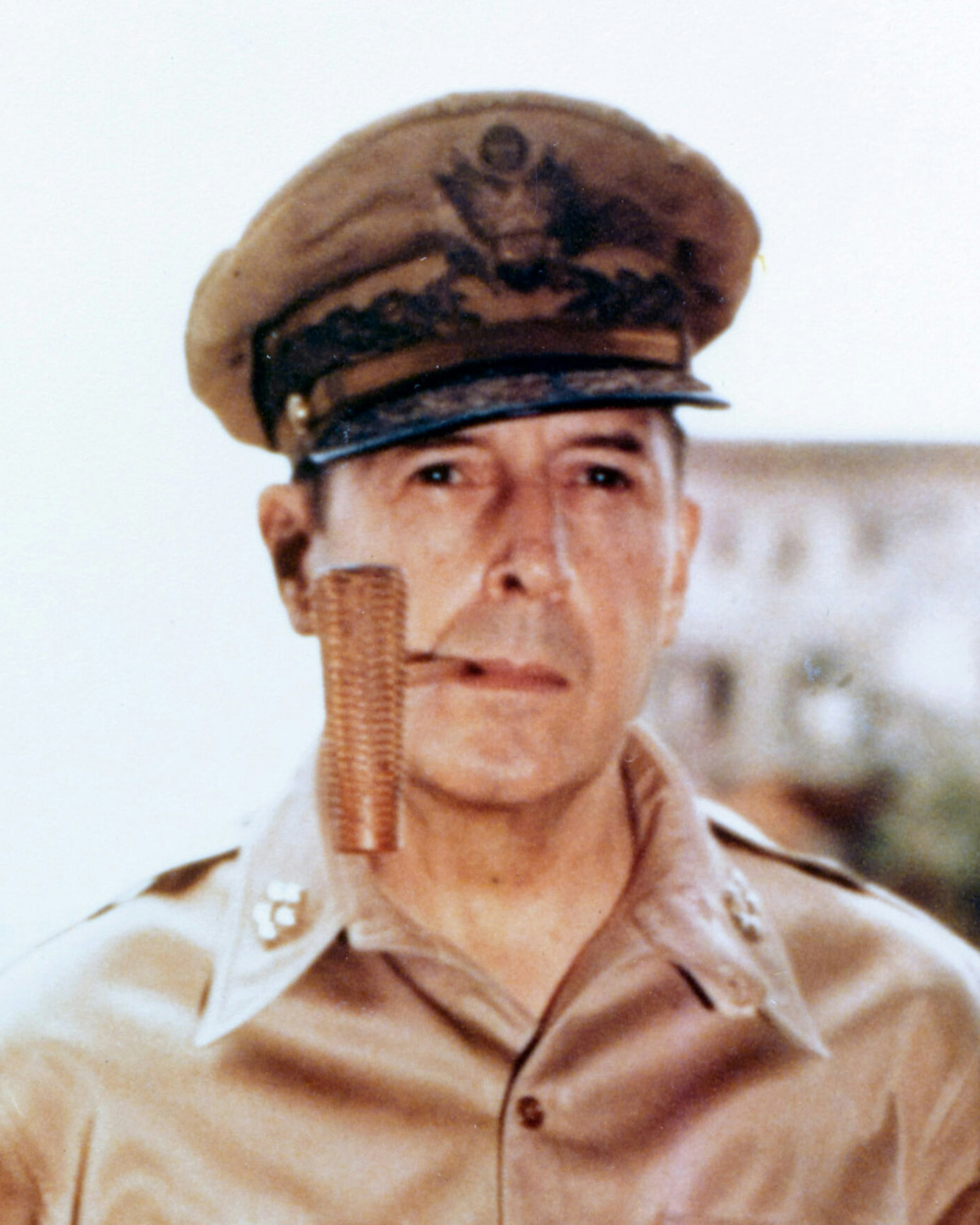 General of the Army Douglas MacArthur smoking his corncob pipe, probably at Manila, Philippine Islands, 2 August 1945. Photograph from the Army Signal Corps Collection in the U.S. National Archives.