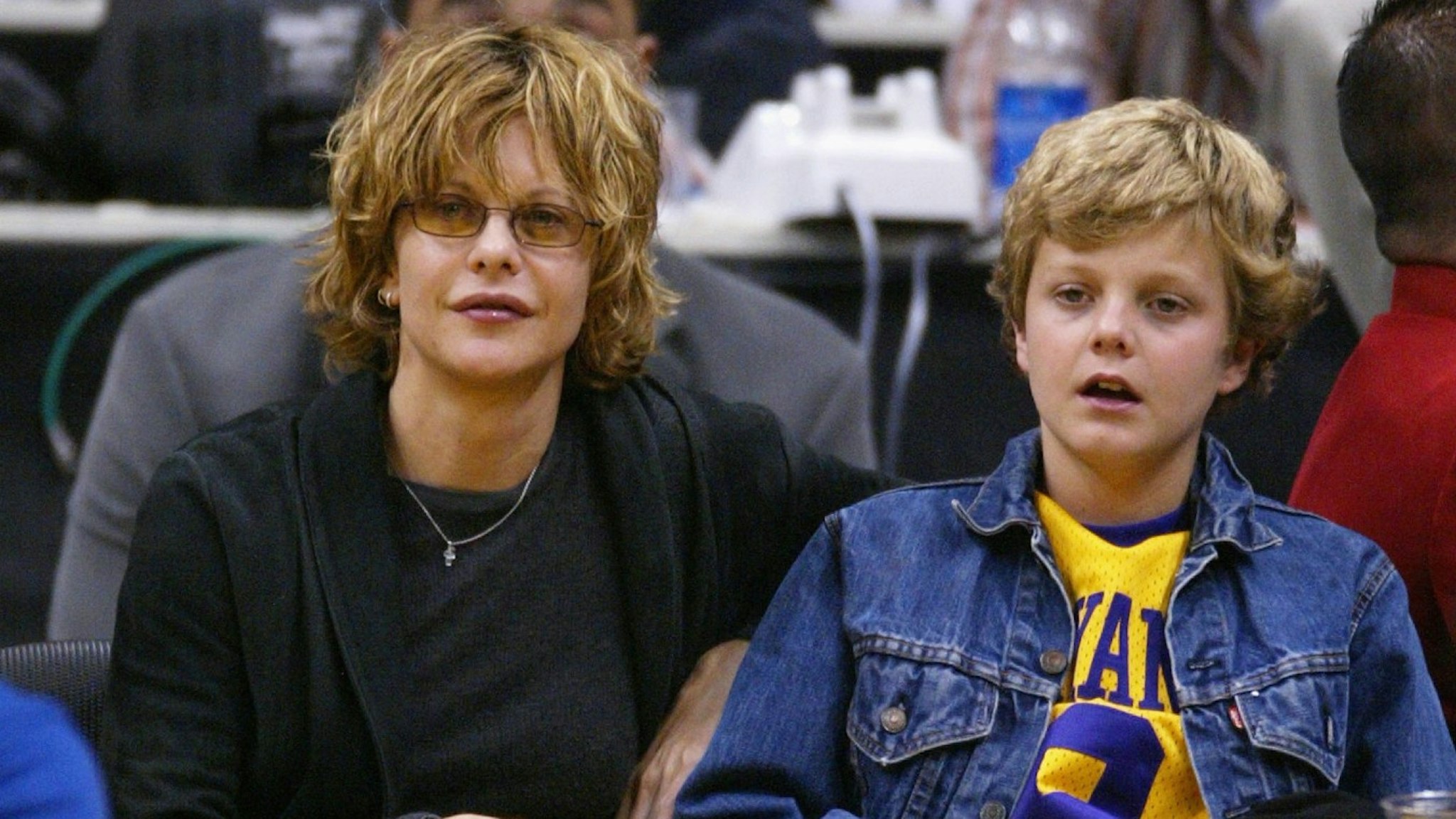 Actress Meg Ryan and son Jack Quaid attend the game between the Los Angeles Lakers and the Portland Trailblazers on April 6, 2004 in Los Angeles, California.