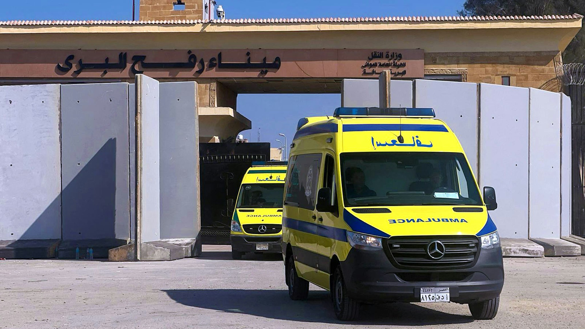 Ambulances cross back into the Egyptian side of the border with the Gaza Strip in Rafah, on November 1, 2023, as they transport wounded to Egyptian field hospitals. Hundreds of injured residents and foreigners escaped Gaza to Egypt on November 1, the first evacuations from the war-torn Palestinian territory pounded by Israeli warplanes in retaliation for an unprecedented Hamas attack.