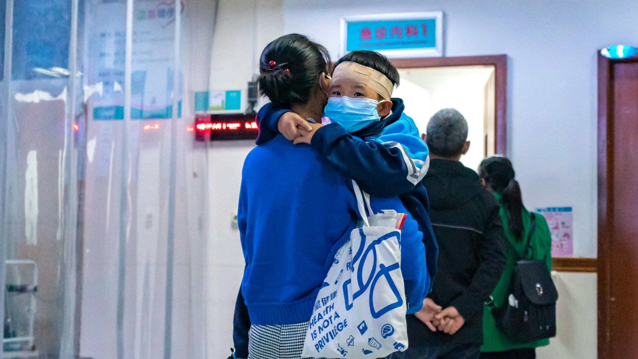 CHONGQING, CHINA - NOVEMBER 23, 2023 - Parents with children suffering from respiratory diseases line up at a children's hospital in Chongqing, China, November 23, 2023.