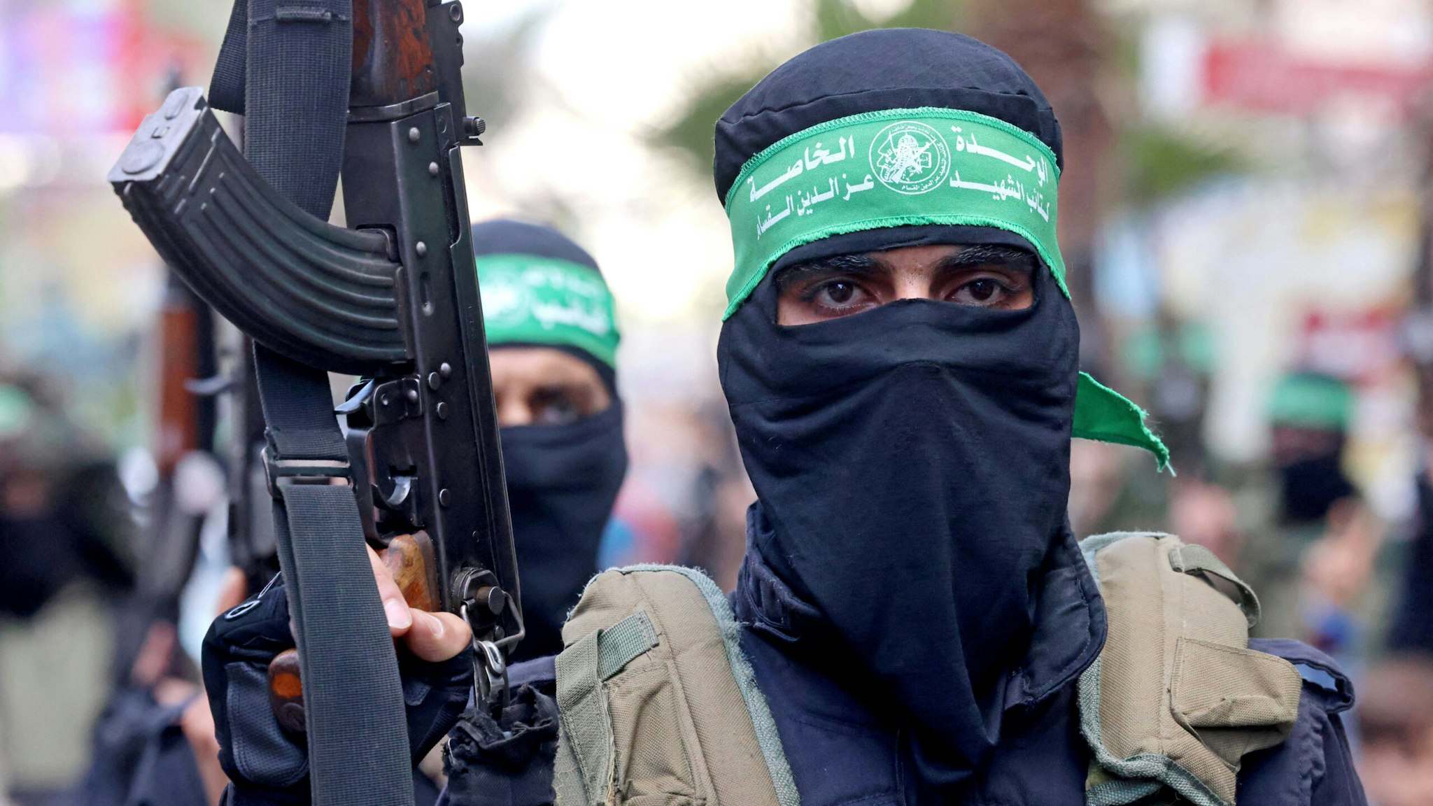 Members of Al-Qassam Brigades, the armed wing of the Palestinian Hamas movement, march in Gaza City on May 22, 2021, in commemoration of senior Hamas commander Bassem Issa who was killed along with other militants in Israeli airstrikes last week.