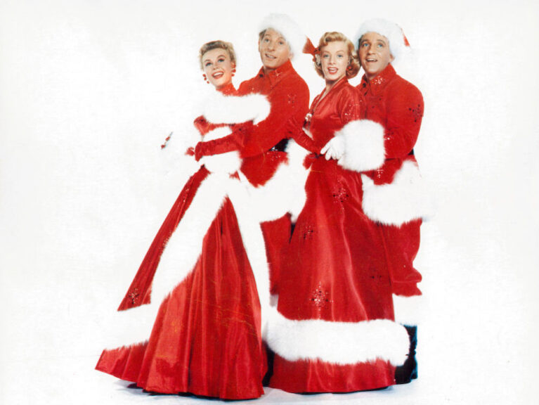 Vera-Ellen, Danny Kaye, Rosemary Clooney and Bing Crosby dressed in Christmas stage costumes in a scene from the film 'White Christmas', 1954. (Photo by Paramount/Getty Images)