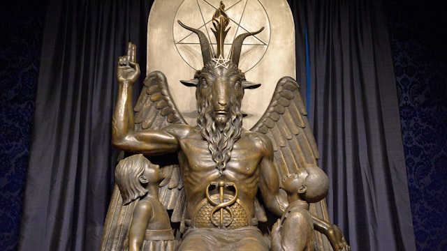The Baphomet statue is seen in the conversion room at the Satanic Temple where a "Hell House" is being held in Salem, Massachusett on October 8, 2019. - The Hell House was a parody on a Christian Conversion centre meant to scare atheist and other Satanic Church members.