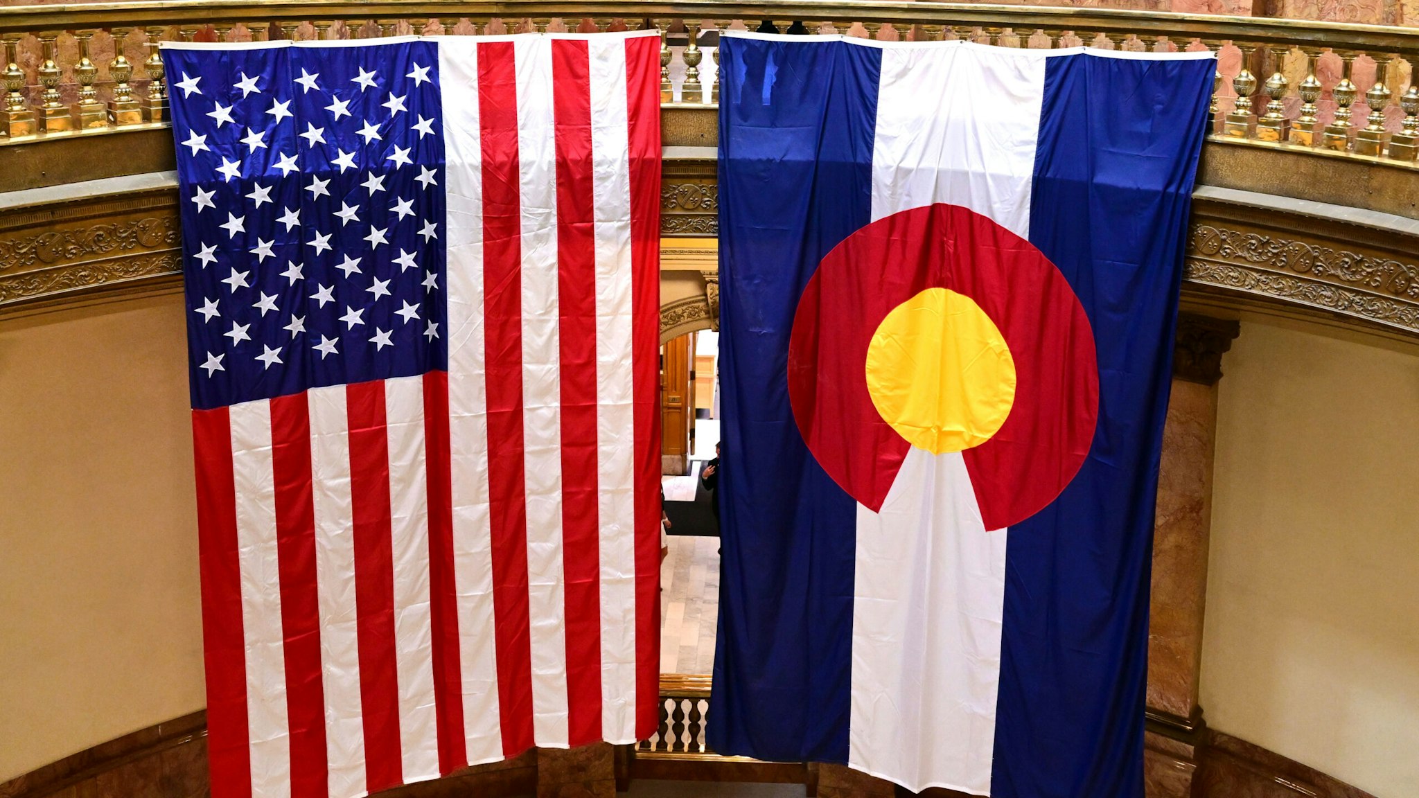 DENVER, CO - JANUARY 9: An American flag and Colorado flag hang in the rotunda at the State Capitol during the opening day session of the 2023 Colorado Legislative session on January 9, 2023 in Denver, Colorado.