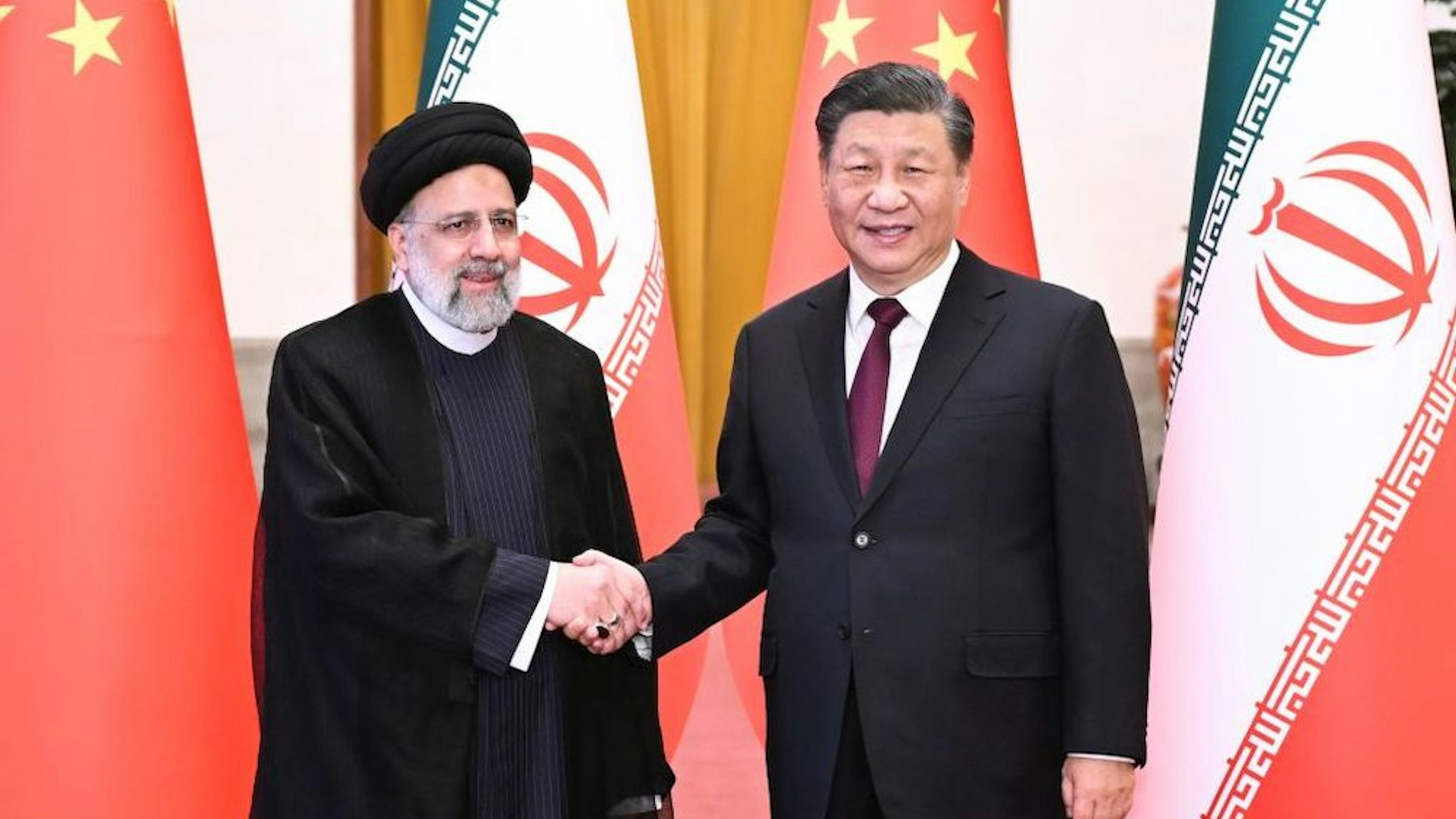 Chinese President Xi Jinping holds a welcoming ceremony for visiting President of the Islamic Republic of Iran Ebrahim Raisi prior to their talks at the Great Hall of the People in Beijing, capital of China, Feb. 14, 2023. (Photo by Yan Yan/Xinhua via Getty Images)