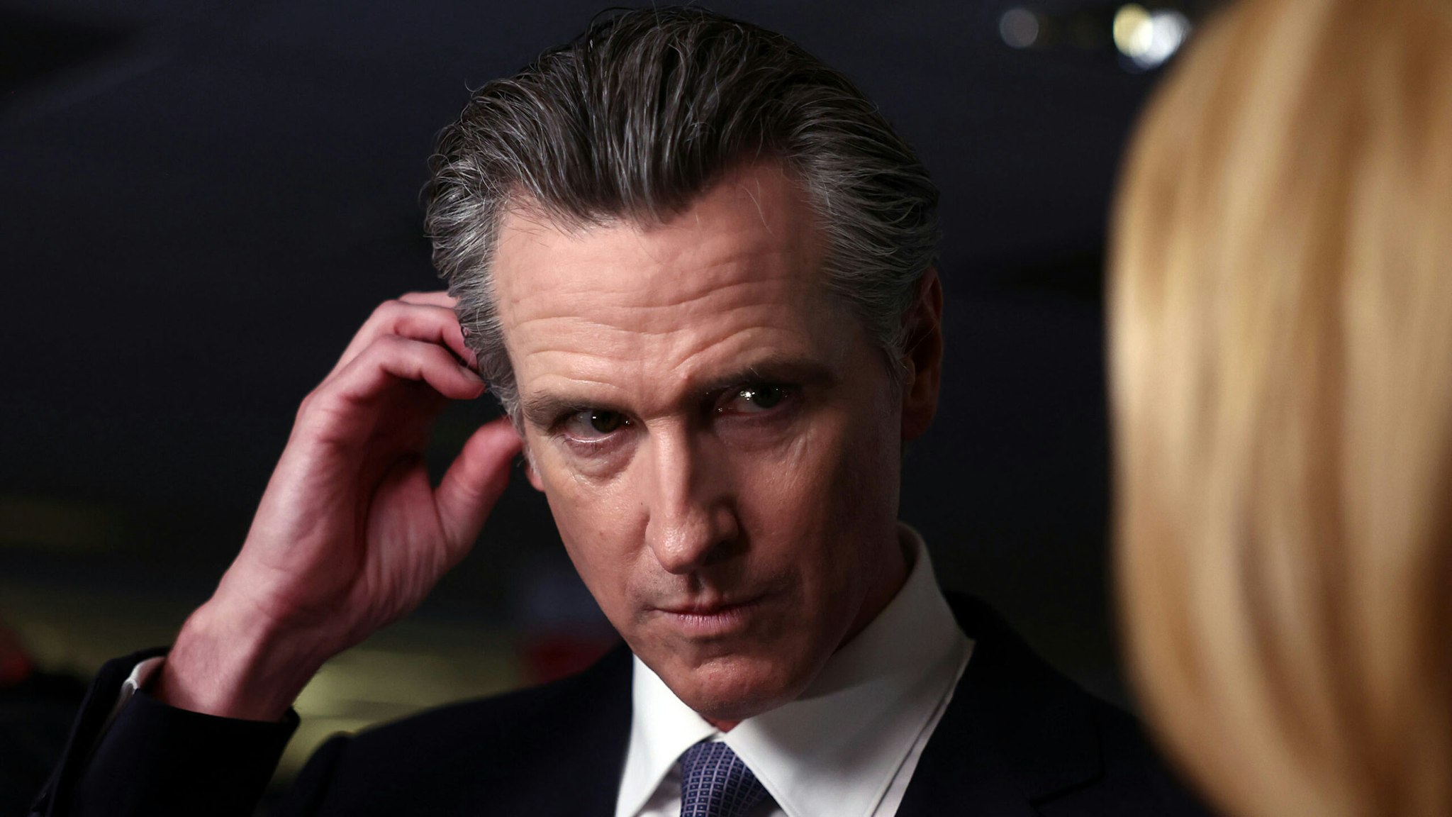 SIMI VALLEY, CALIFORNIA - SEPTEMBER 27: California Gov. Gavin Newsom talks to reporters in the spin room following the FOX Business Republican Primary Debate at the Ronald Reagan Presidential Library on September 27, 2023 in Simi Valley, California. Seven presidential hopefuls squared off in the second Republican primary debate as former U.S. President Donald Trump, currently facing indictments in four locations, declined again to participate.