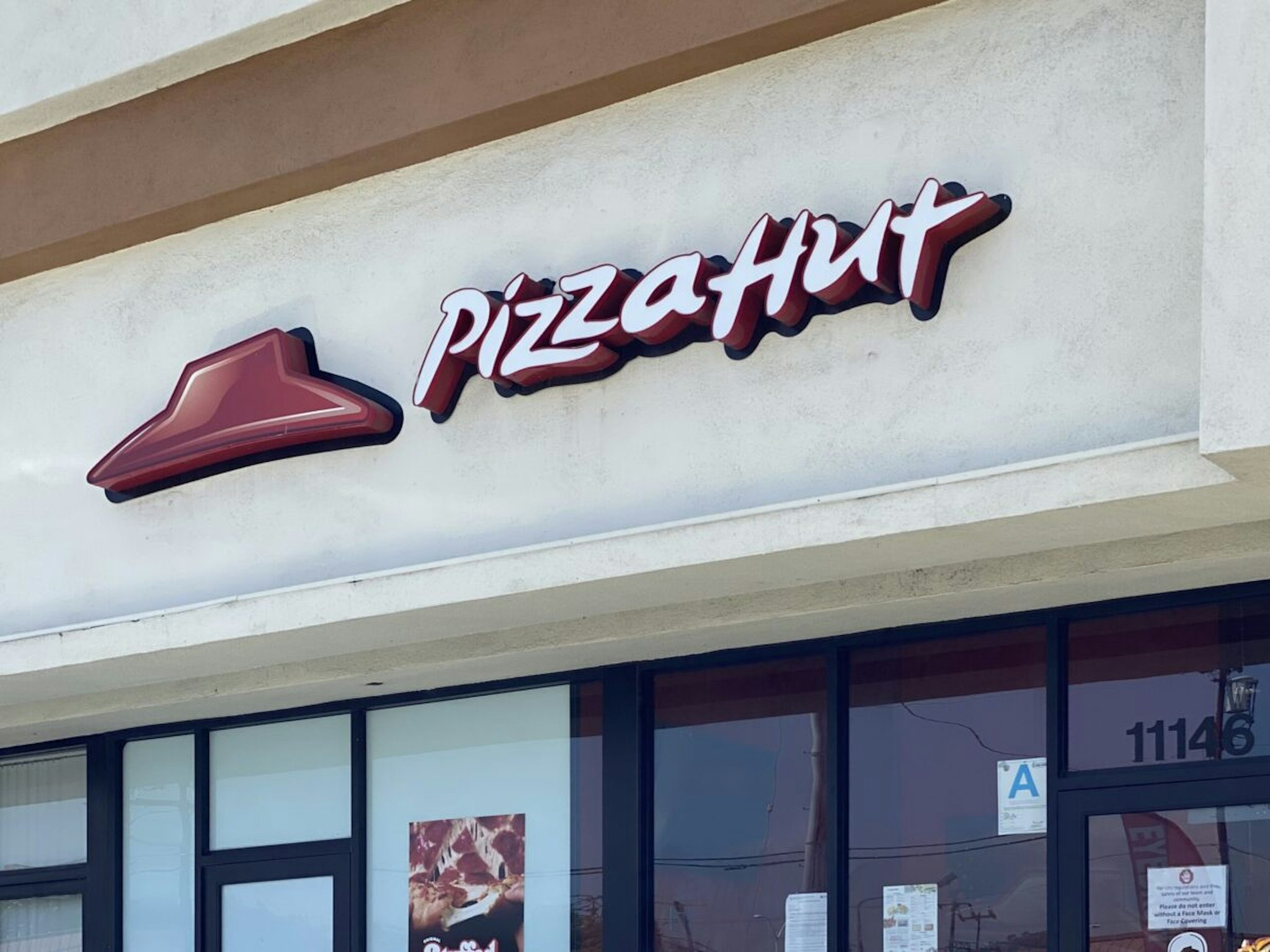 A Pizza Hut restaurant is seen in Los Angeles in July 2, 2020. - NPC International Inc, the largest franchisee of Pizza Hut restaurants in the US, filed for bankruptcy after coronavirus-related shutdowns added to competitive pressures in the restaurant industry. The closely held company sought Chapter 11 protection in the Southern District of Texas court on July 1, 2020. NPC, founded in 1962, operates 1,227 Pizza Hut and 393 Wendys stores across the US, according to court papers.