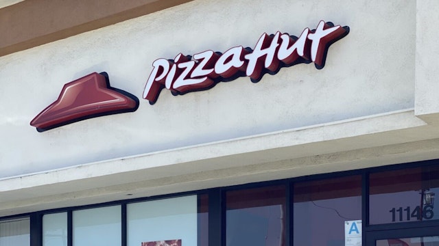 A Pizza Hut restaurant is seen in Los Angeles in July 2, 2020. - NPC International Inc, the largest franchisee of Pizza Hut restaurants in the US, filed for bankruptcy after coronavirus-related shutdowns added to competitive pressures in the restaurant industry. The closely held company sought Chapter 11 protection in the Southern District of Texas court on July 1, 2020. NPC, founded in 1962, operates 1,227 Pizza Hut and 393 Wendys stores across the US, according to court papers.