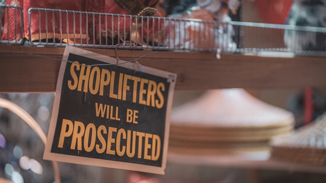 Shoplifters will be prosecuted sign - stock photo