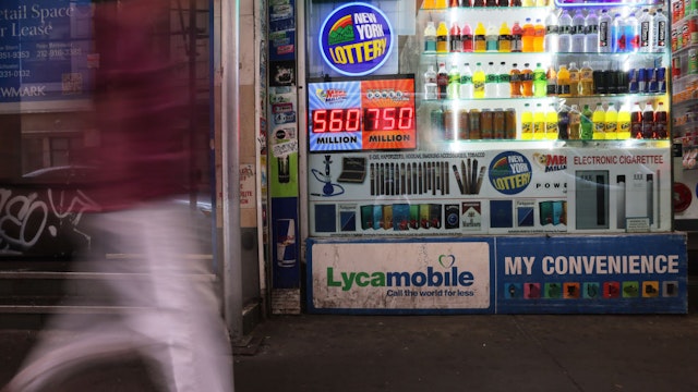 NEW YORK, NEW YORK - JULY 12: A Powerball and Mega Millions lottery advertisement is displayed at a convenience store on July 12, 2023 in New York City. The Powerball jackpot reached an estimated $725 million for the next drawing with a cash option for the jackpot at an estimated $366 million. The current jackpot, which is played in 45 states, as well as Washington, D.C., Puerto Rico and the U.S. Virgin Islands, has been growing since mid-April after a $252.6 million prize was won in Ohio. (Photo by Michael M. Santiago/Getty Images)