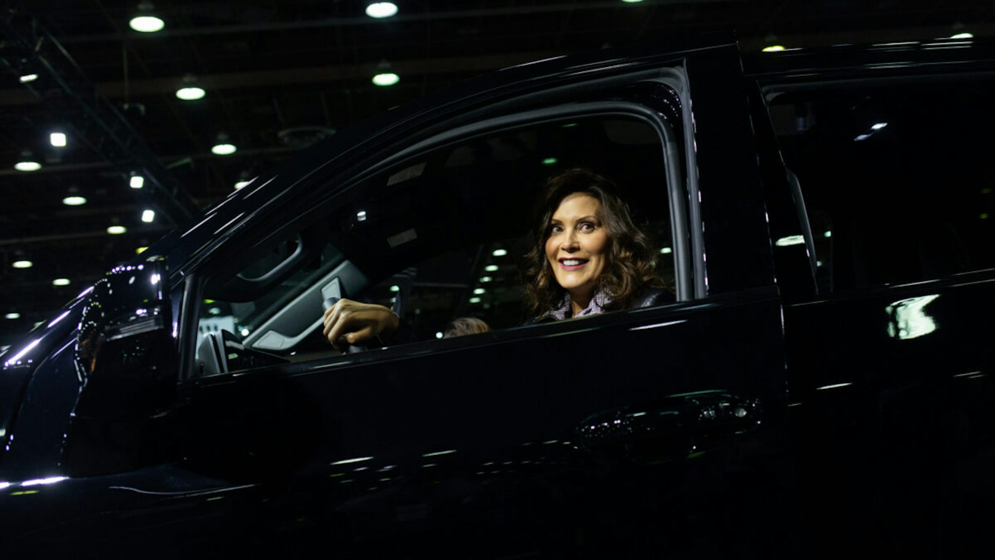 Gretchen Whitmer, governor of Michigan, sits inside a 2024 Chevrolet Silverado electric truck during the 2023 North American International Auto Show (NAIAS) in Detroit, Michigan, US, on Thursday, Sept. 14, 2023. The event showcases over 20 attractions, events, and shows about vehicles and the ever-growing technology behind them.
