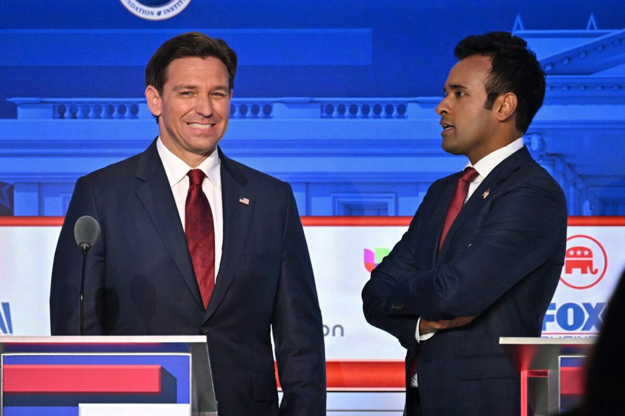 Entrepreneur Vivek Ramaswamy (R) speaks to Florida Governor Ron DeSantis following the second Republican presidential primary debate at the Ronald Reagan Presidential Library in Simi Valley, California, on September 27, 2023.