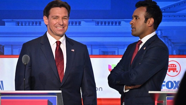 Entrepreneur Vivek Ramaswamy (R) speaks to Florida Governor Ron DeSantis following the second Republican presidential primary debate at the Ronald Reagan Presidential Library in Simi Valley, California, on September 27, 2023.