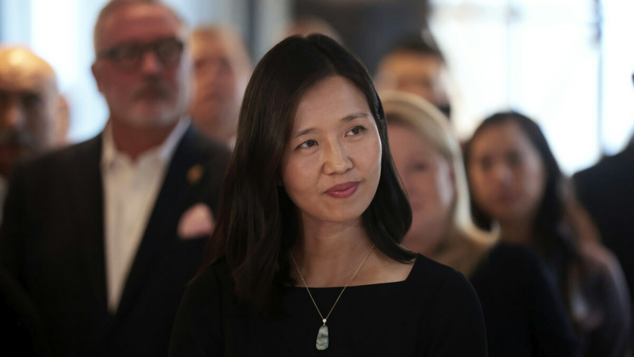 Boston, MA - September 18: Boston Mayor Michelle Wu listens to Noannet Group president Jordan Warshaw speak.