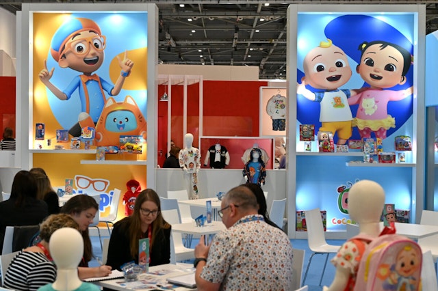 LONDON, ENGLAND - OCTOBER 04: Posters showing Blippi and Cocomelon Characters is displayed at the Moonbug Entertainment stand during the Brand Licensing Europe at ExCel on October 04, 2023 in London, England. Brand Licensing Europe (BLE) event is dedicated to licensing and brand extension, bringing together retailers, licensees and manufacturers for three days of deal-making, networking and trend spotting.