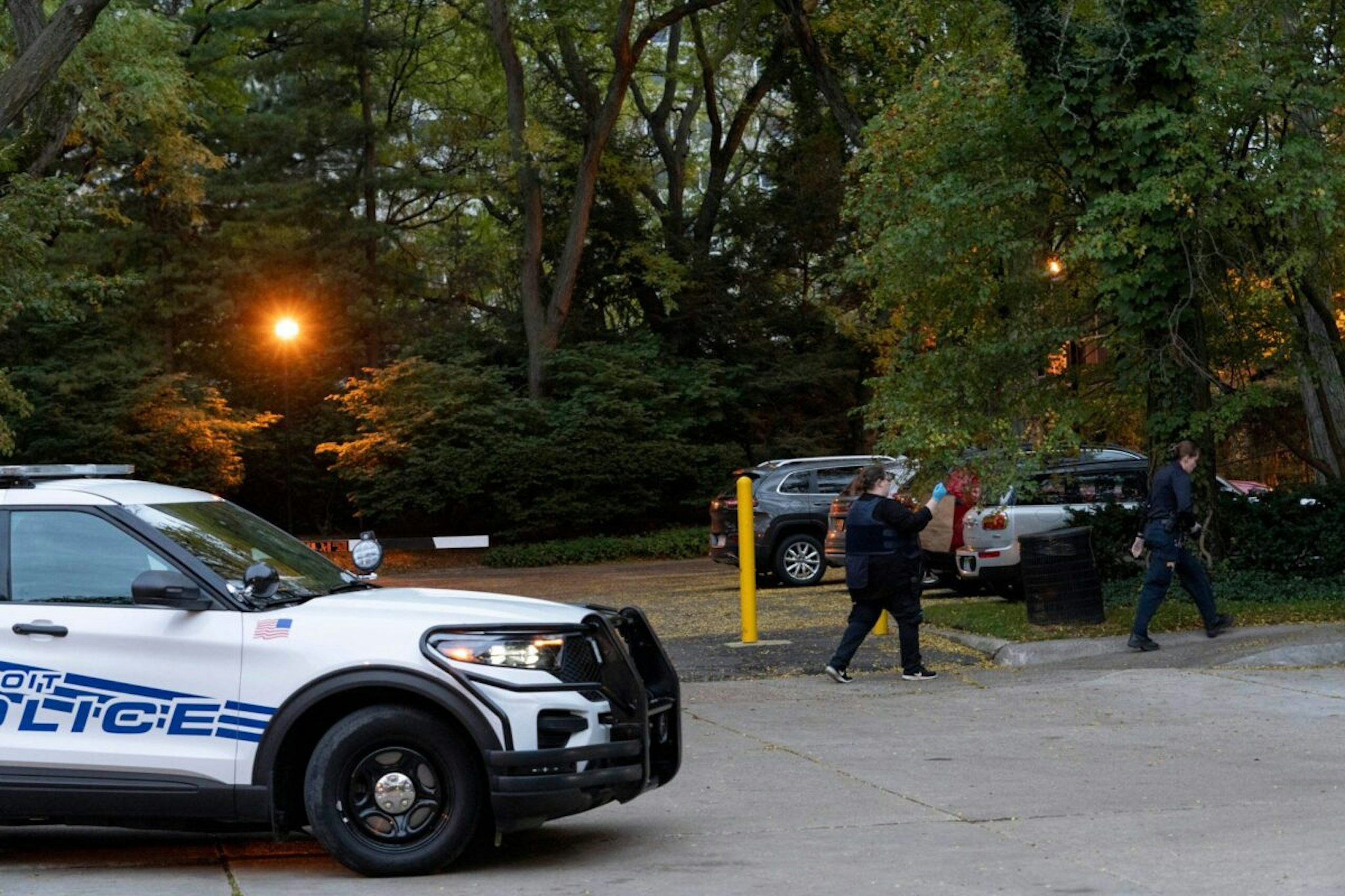 Detroit police officers work near the scene where Isaac Agree Downtown Synagogue president, Samantha Woll, was found dead in Detroit, October 21, 2023.