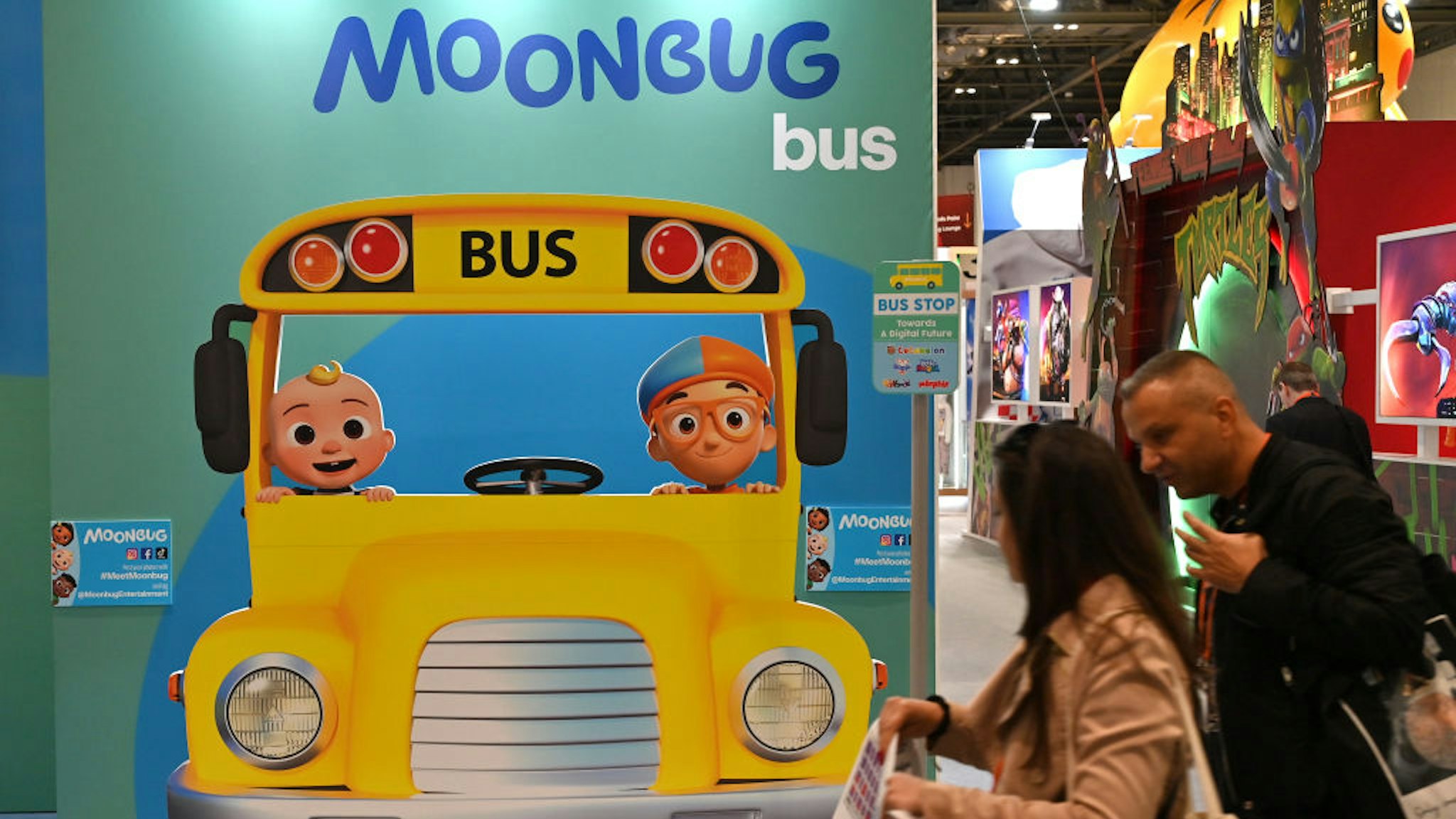 LONDON, ENGLAND - OCTOBER 04: Visitors view the Moonbug Entertainment stand showing Blippi and Cocomelon characters during the Brand Licensing Europe at ExCel on October 04, 2023 in London, England. Brand Licensing Europe (BLE) event is dedicated to licensing and brand extension, bringing together retailers, licensees and manufacturers for three days of deal-making, networking and trend spotting. (Photo by John Keeble/Getty Images)