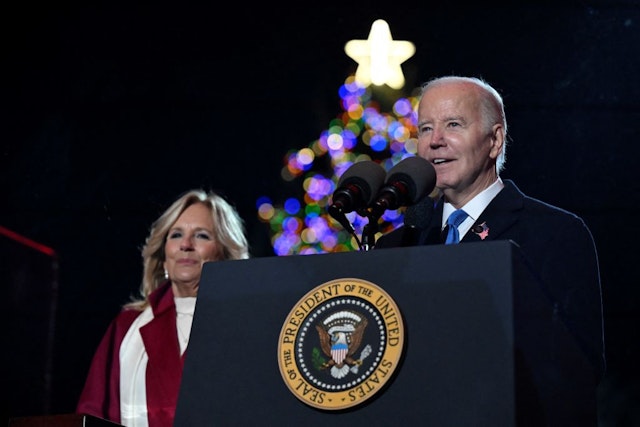 TOPSHOT - US President Joe Biden speaks as First Lady Jill Biden looks on during the National Christmas tree lighting ceremony on the Ellipse of the White House in Washington, DC, on November 30, 2023. (Photo by ANDREW CABALLERO-REYNOLDS / AFP) (Photo by ANDREW CABALLERO-REYNOLDS/AFP via Getty Images)