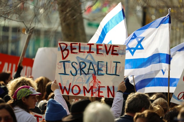 Demonstrators gather during a "#metoo unless you are a Jew" protest outside of United Nations headquarters in New York City on December 4, 2023. Israeli women and legal activists have accused international rights groups of maintaining a conspiracy of silence over alleged rapes and other sexual crimes committed by Hamas militants during the October 7 attacks. In addition to investigating the bloodshed, Israeli police say they have been exploring evidence of sexual violence, ranging from alleged gang rape to post-mortem mutilation. (Photo by Charly TRIBALLEAU / AFP) (Photo by CHARLY TRIBALLEAU/AFP via Getty Images)