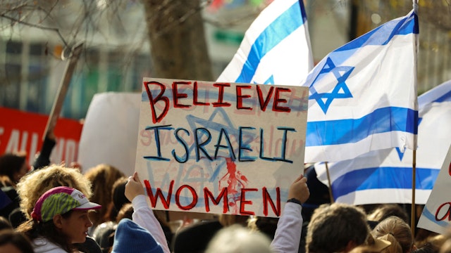 Demonstrators gather during a "#metoo unless you are a Jew" protest outside of United Nations headquarters in New York City on December 4, 2023. Israeli women and legal activists have accused international rights groups of maintaining a conspiracy of silence over alleged rapes and other sexual crimes committed by Hamas militants during the October 7 attacks. In addition to investigating the bloodshed, Israeli police say they have been exploring evidence of sexual violence, ranging from alleged gang rape to post-mortem mutilation. (Photo by Charly TRIBALLEAU / AFP) (Photo by CHARLY TRIBALLEAU/AFP via Getty Images)