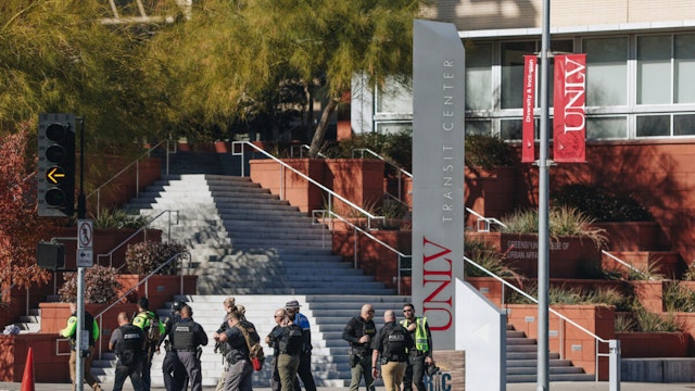 Police are seen at the scene of a shooting on the UNLV campus on Wednesday, Dec. 6, 2023, in Las Vegas.