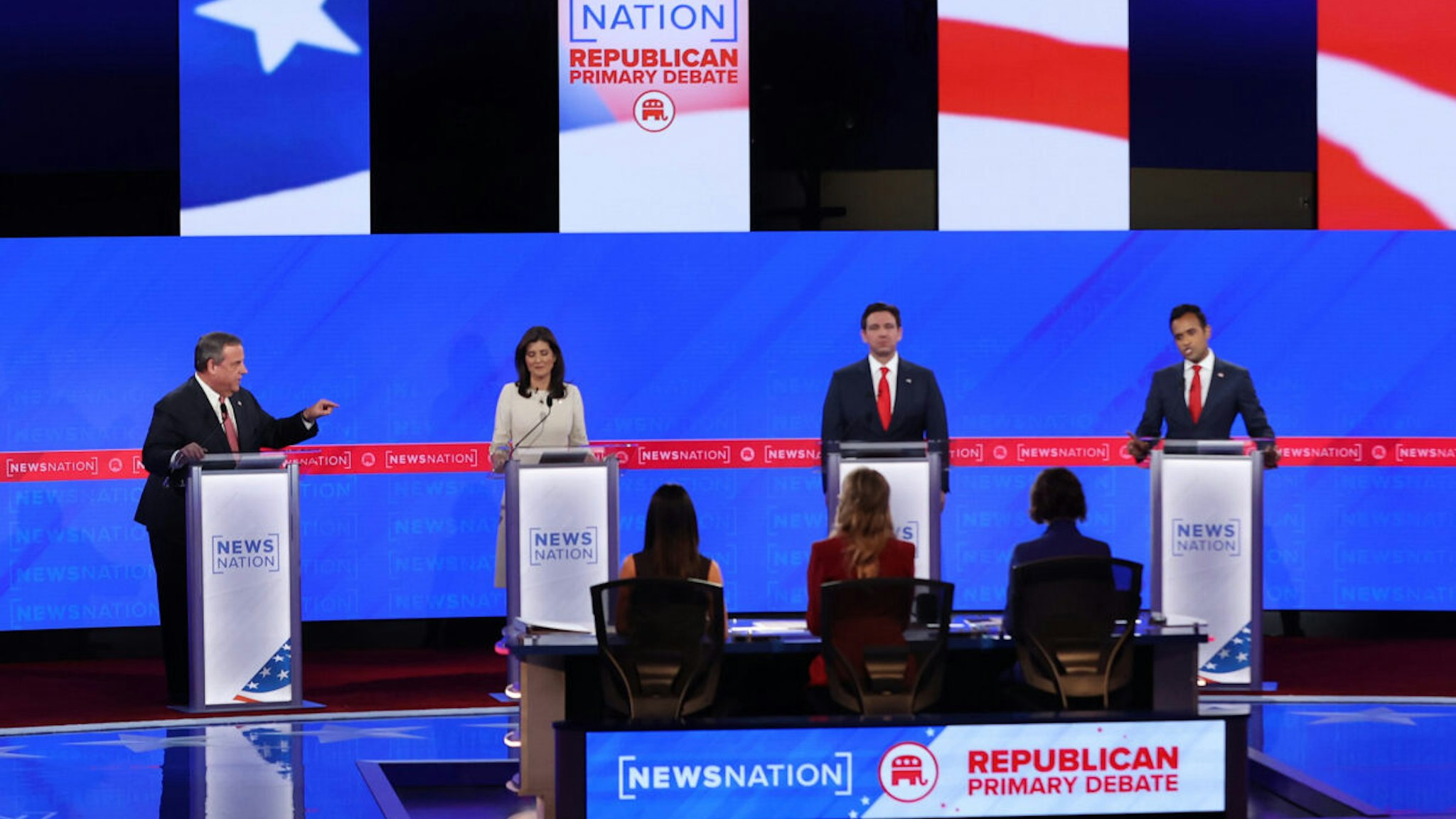 TUSCALOOSA, ALABAMA - DECEMBER 06: Republican presidential candidates (L-R) former New Jersey Gov. Chris Christie, former U.N. Ambassador Nikki Haley, Florida Gov. Ron DeSantis and Vivek Ramaswamy participate in the NewsNation Republican Presidential Primary Debate at the University of Alabama Moody Music Hall on December 6, 2023 in Tuscaloosa, Alabama. The four presidential hopefuls squared off during the fourth Republican primary debate without current frontrunner and former U.S. President Donald Trump, who has declined to participate in any of the previous debates.