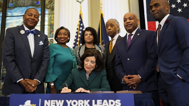 NEW YORK, NEW YORK - DECEMBER 19: New York Gov. Kathy Hochul speaks signs legislation creating a commission for the study of reparations in New York on December 19, 2023 in New York City. Gov. Hochul was joined by Rev. Al Sharpton, various members of New York government leadership and influential community members six months after state lawmakers passed the bill and three years after California became the first state to create a reparations task force. The bill creates a nine-member commission that would study the effects of slavery in the state and make non-binding recommendations on reparations. Three members would be appointed by the governor, three by the assembly and three by the senate.